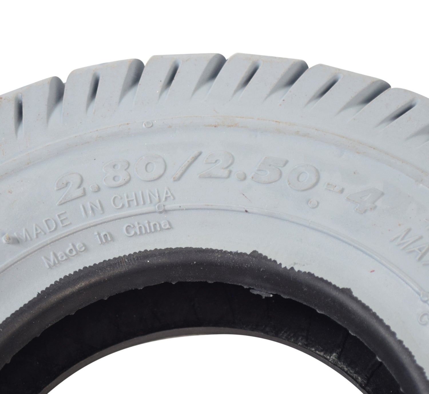 Close-up of the 9x3 (2.80/2.50-4) Pneumatic Mobility Tire with Durotrap C9210 Tread, showing the intricate tread pattern and smooth profile for efficient rolling on hard surfaces.