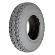 Close-up of a 4.10/3.50-6 Foam Filled Drive Tire for the Jazzy 1143 and 1143 Ultra, showcasing its tread pattern and durable construction designed for power chairs.