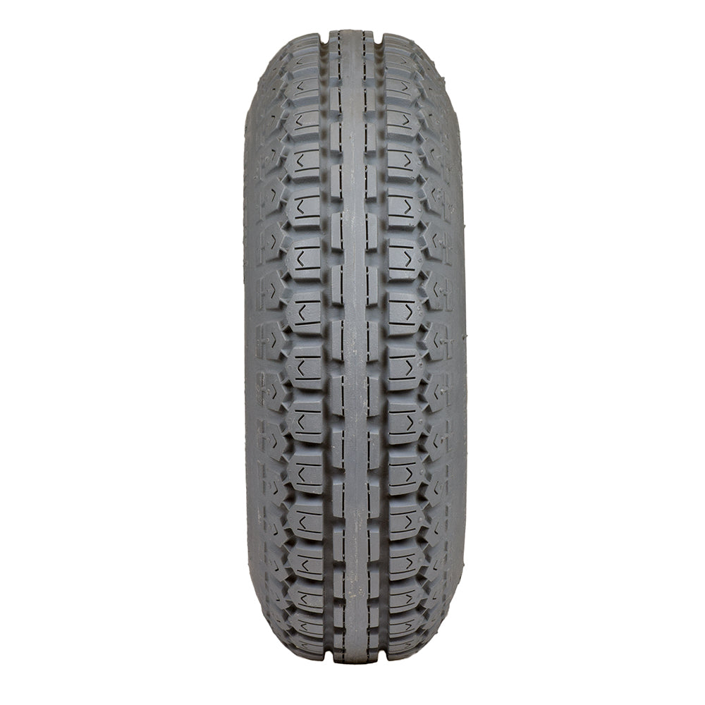 Close-up of the 4.10/3.50-6 Foam Filled Drive Tire for the Jazzy 1143 and 1143 Ultra, highlighting the detailed tread pattern designed for durability and performance in power chairs.