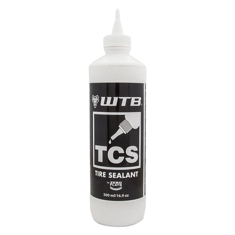 TCS Tire Sealant - 500 ml Bottle, a white bottle with a black label, including an applicator for removable core valves, designed to seal punctures and maintain tire flexibility without altering rubber properties.