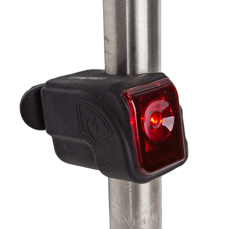 Close-up of the TL-L106 USB Taillight, showing its red light mounted on a metal pole, designed for bicycles and scooters.