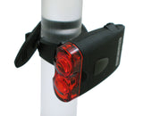 Close-up of the TL-L205 USB Taillight mounted on a bicycle tube, showcasing its compact design and essential rear safety lighting for bikes and scooters in low-light conditions.