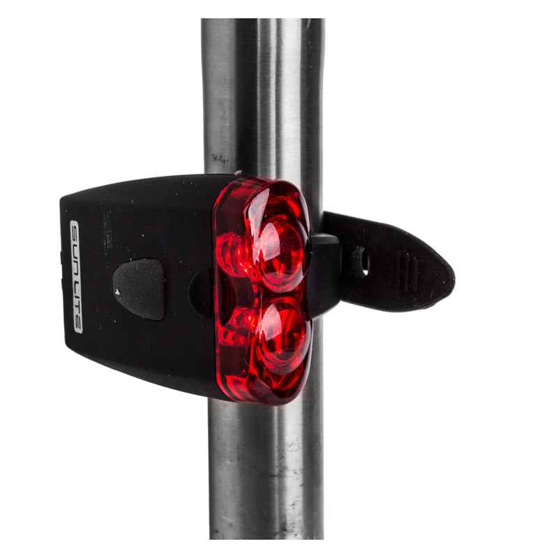 Close-up of the TL-L205 USB Taillight, showing its compact design ideal for bike and scooter rear safety in low-light conditions.