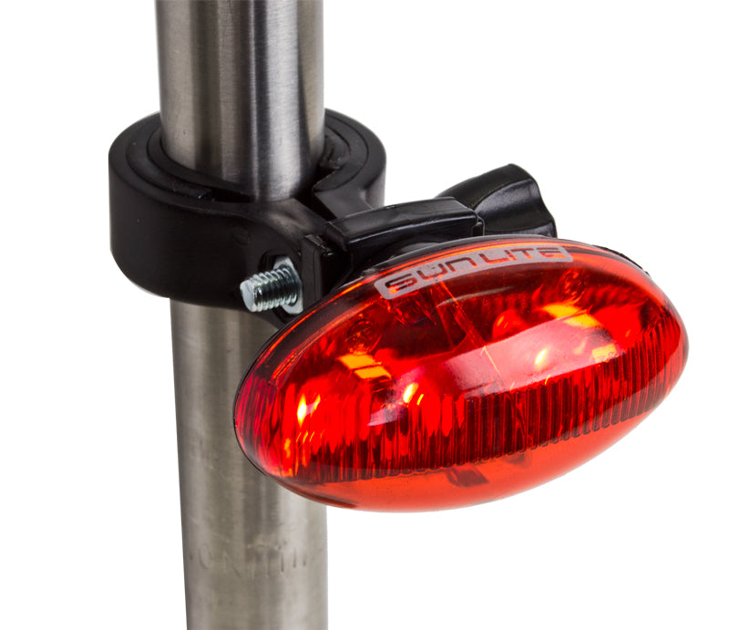 TL-L420 4-LED Taillight mounted on a pole, showcasing its bright, compact design essential for night riding safety on bicycles and scooters.