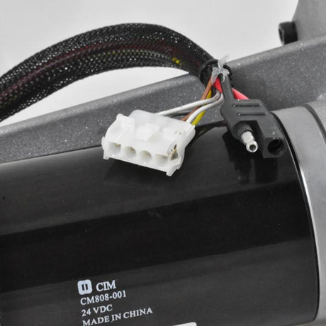 Close-up of the Motor, Brake, & Transaxle Assembly for the Rascal 230, 235, 300, & 600T (Blemished) with visible scratches on the motor case, highlighting the cables and connectors.