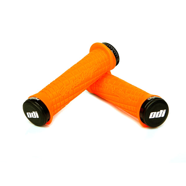 Troy Lee ODI Lock-on Handlebar Grips for Bikes & Scooters, featuring a pair of grooved handlebar grips with lock-on clamps, designed to prevent mud buildup and provide added hand support.