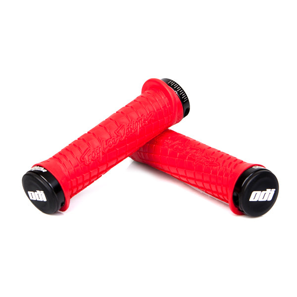 Troy Lee ODI Lock-on Handlebar Grips for Bikes & Scooters, showcasing grooved channels, overmolded flap, and custom flanged design, offering a secure and comfortable grip.