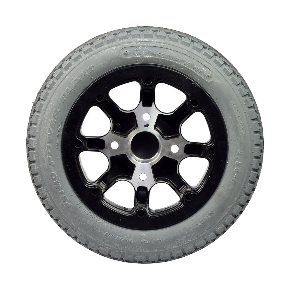 Drive Wheel Assembly for the Quickie Pulse 6 (Used), featuring a black tire with minimal tread wear and a silver rim with minor scratches, showcasing the Primo brand 2.50-8 tire and C177G Power Plant Knobby tread.