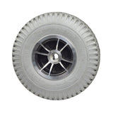 Foam-Filled Drive Wheel Assembly for Rascal 312 (Used) featuring a knobby tread tire, centered hubcap, and split-rim design. The wheel shows minimal wear with a few tread stains.