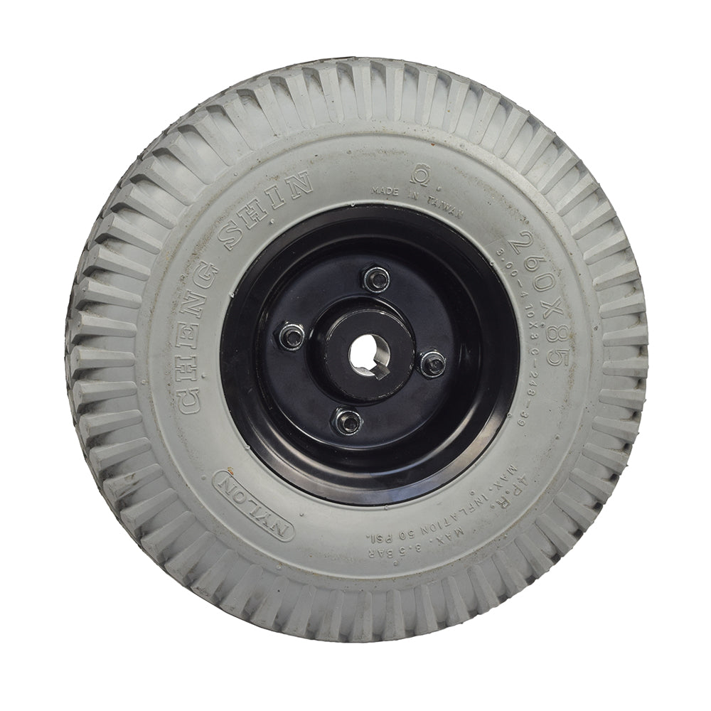 Foam-Filled Drive Wheel Assembly for Rascal 312 (Used), featuring a black rim, knobby tread, and minimal wear, ideal for quick mounting and future tire replacements.