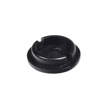 Caster Cap for the Quickie Pulse 6 (Used): A black round object with a central hole designed to seal dirt and moisture out of caster wheel bearings, extending the life of the power chair's moving parts.