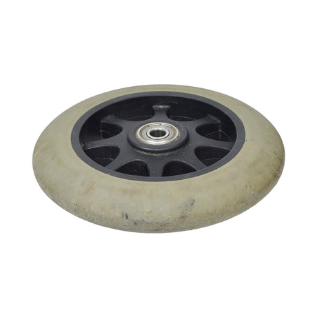 Anti-Tip Front Wheel for the Jazzy 1107, Select, & Select GT (Used) featuring a black rim and visible signs of wear, designed to prevent tipping in power chairs.