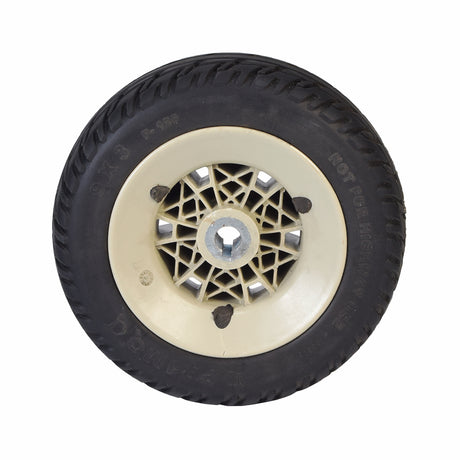 9x3 Flat-Free Drive Wheel Assembly for Jazzy Select Elite & Pride TSS 300 (Used) - Close-up of a solid black tire with minimal tread wear, mounted on a silver rim.