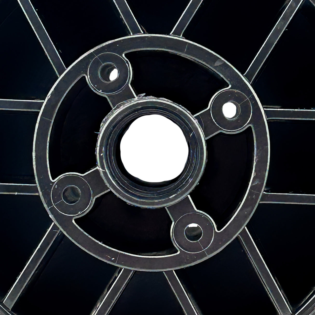 Drive Wheel for the Rollplay 12 Volt Nighthawk, showcasing a close-up of the 6-1/4 diameter rubber tire molded onto the rim, with visible holes and symmetrical design, emphasizing its circular structure.