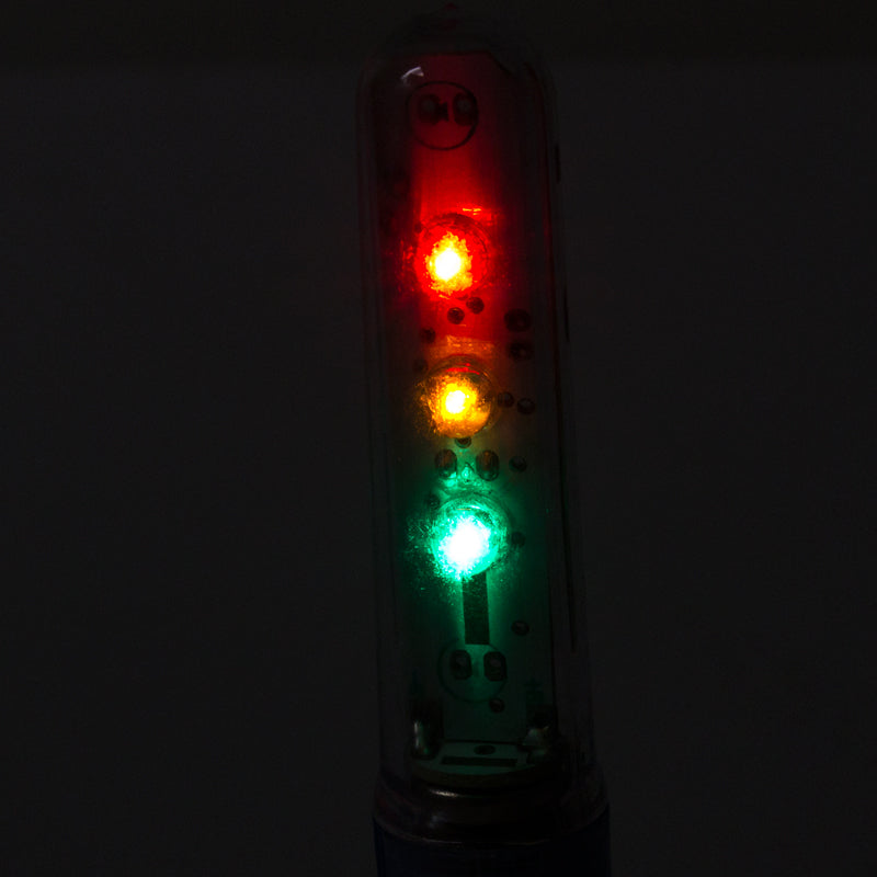 Close-up of the Valve Stem Wheel Flash Saber in Red/Yellow/Green, highlighting its light feature designed for bikes and scooters.