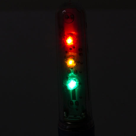 Close-up of the Valve Stem Wheel Flash Saber in Red/Yellow/Green, highlighting its light feature designed for bikes and scooters.