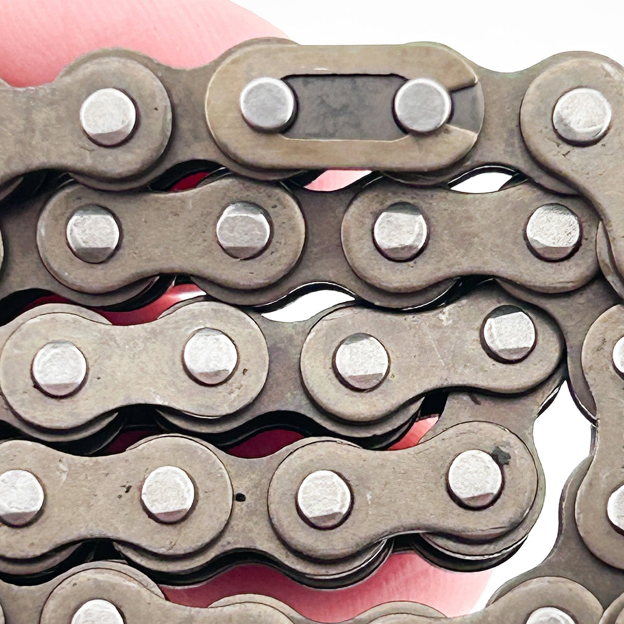 70 Link #25 Chain held in a person's hand, showcasing the high-quality metal links designed for eZip Nano and Nano Carver electric scooters, ideal for various custom projects.