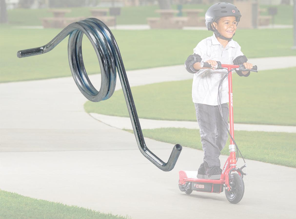 Child riding a scooter with a close-up of a metal spring. Product: Chain Tensioner Spring for Razor E100, E100 Glow, E150, E175, & E90 Accelerator, shown in detail.