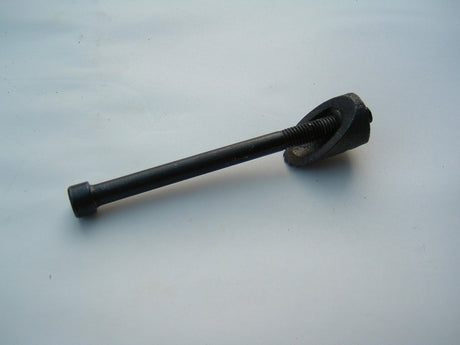 Wedge and Bolt for 15/16 OD Forks, featuring a black metal object paired with a matching bolt, ideal for securing components.