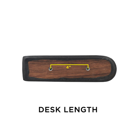 Black Vinyl Co-Molded Armrest Pad for Pride Scooters shown on a wooden surface with a yellow line, featuring a square end and a round end, designed to fit over the armrest weldment.