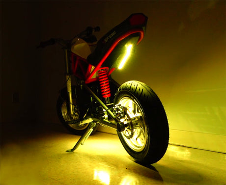 Multi-Color LED Light Kit for Razor Electric Bikes & Scooters, featuring a motorcycle wheel with bright LED lights, a red coil spring, and a kickstand, highlighting the customizable lighting options.