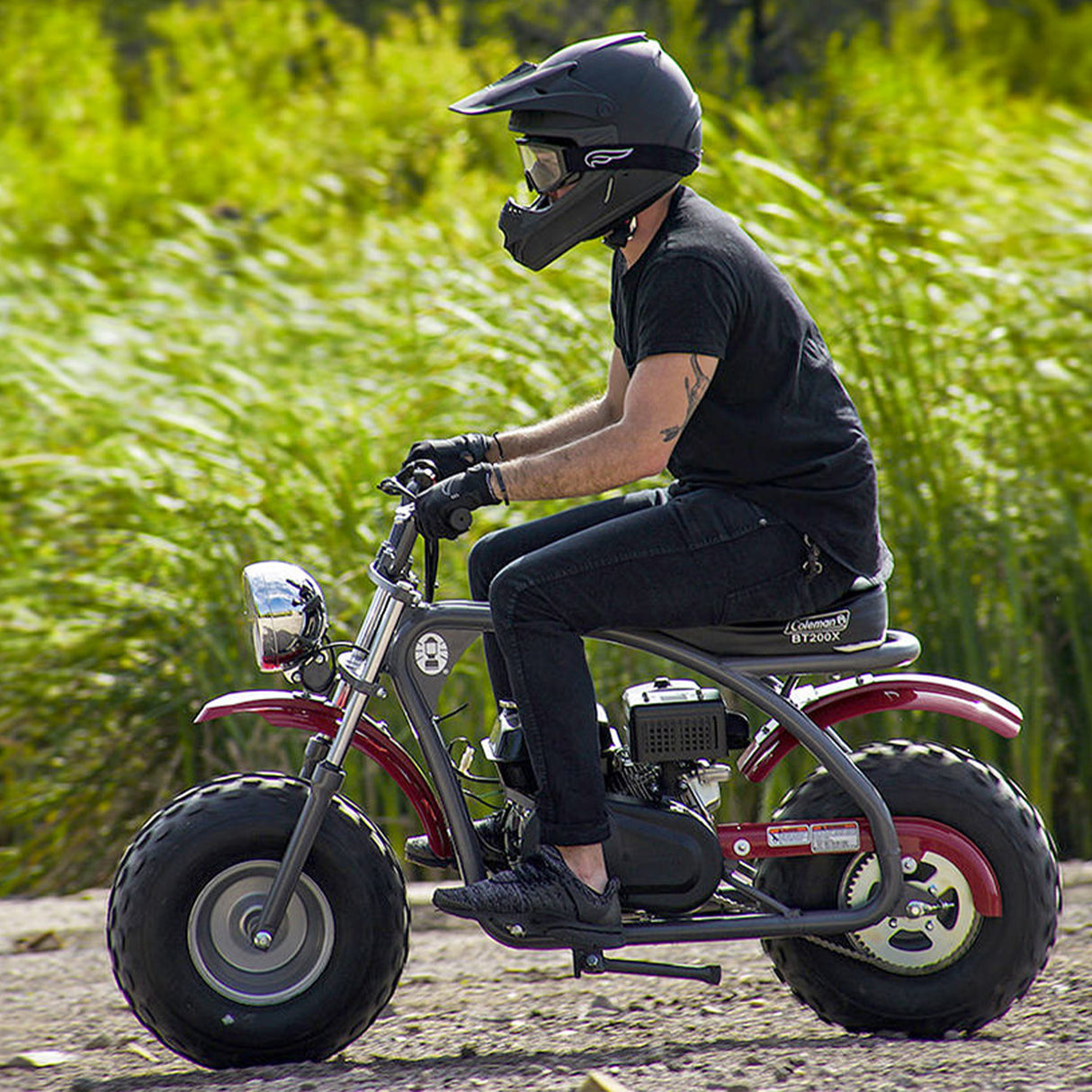 Man riding a small motorcycle, showcasing the Clutch Assembly with 10-Tooth 420 Chain Sprocket for the Coleman BT200X, CT200U Trail & CT200U-EX Mini Bikes.