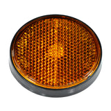 Close-up of the Dark Amber Front Side Reflector for the Baja Mini Bike MB165 & MB200, showcasing its textured surface and reflective quality, essential for enhancing visibility and safety on various vehicles.