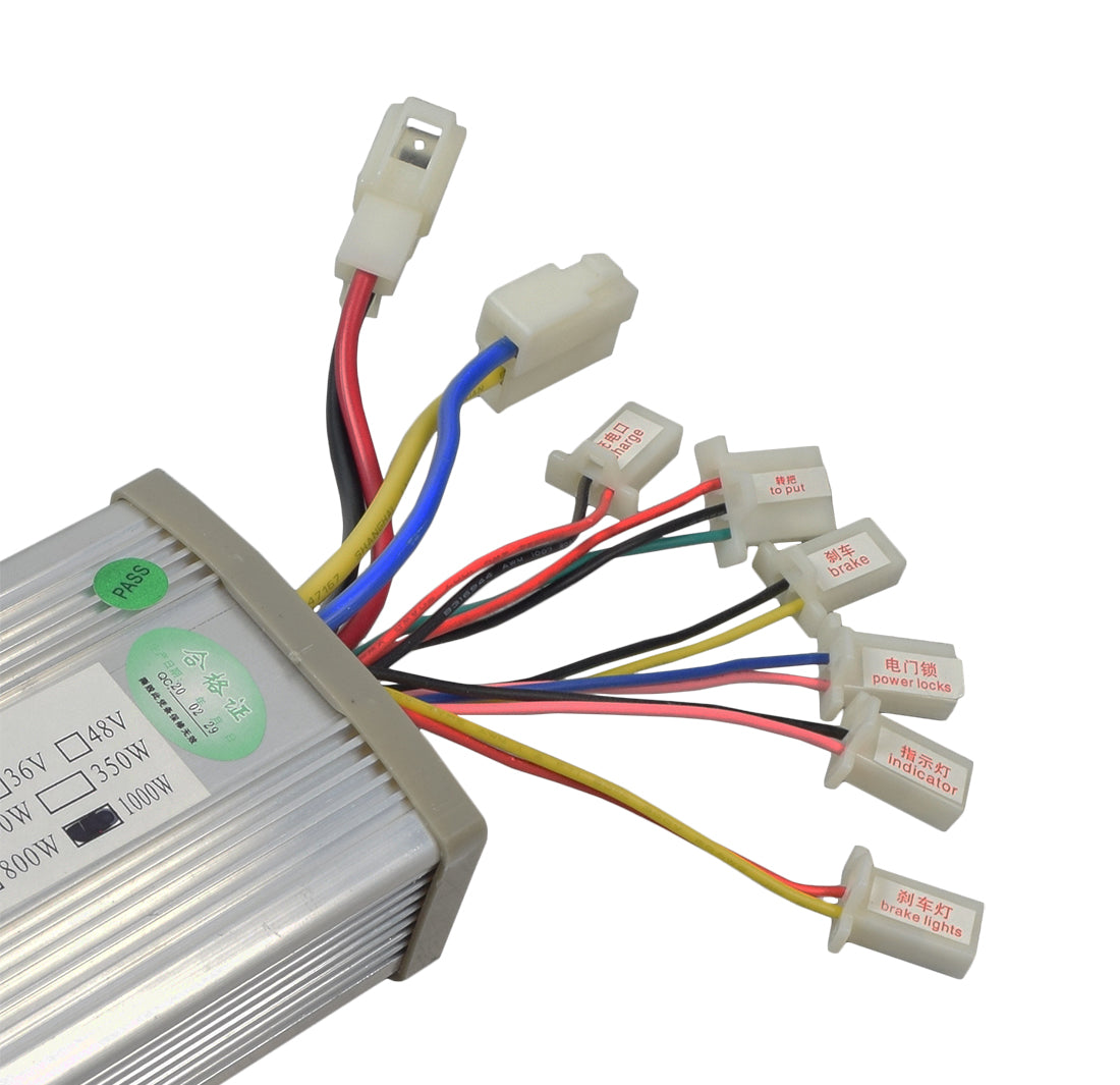 Close-up of a 24 Volt 1000 Watt Permanent Magnet Universal Speed & Voltage Controller showing colorful wiring connections, a green sticker label, and various connectors for battery, motor, and throttle.