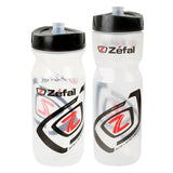 Sense Water Bottle by Zéfal: Two translucent white plastic bottles with black soft caps and a red and black logo, available in 22 oz. or 27 oz. capacities, ideal for cyclists and outdoor enthusiasts.